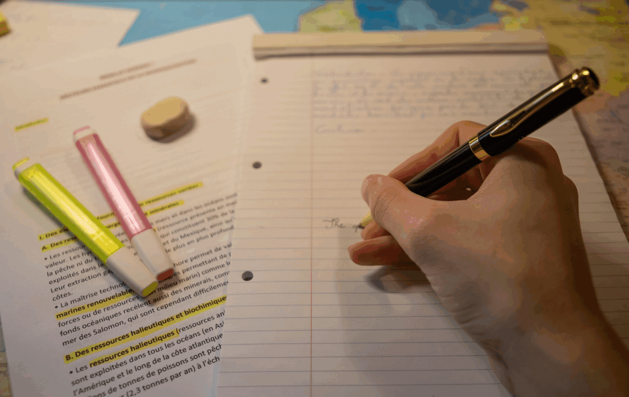 A person writing on a notebook