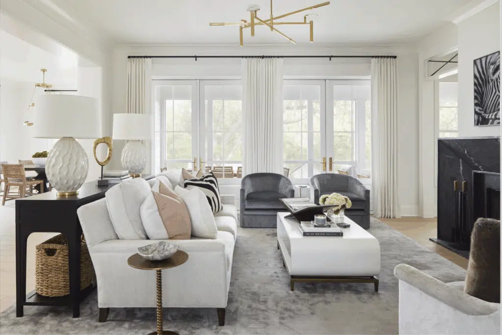 Modern living room in St. Petersburg move-in ready home with white sofas and large windows.
