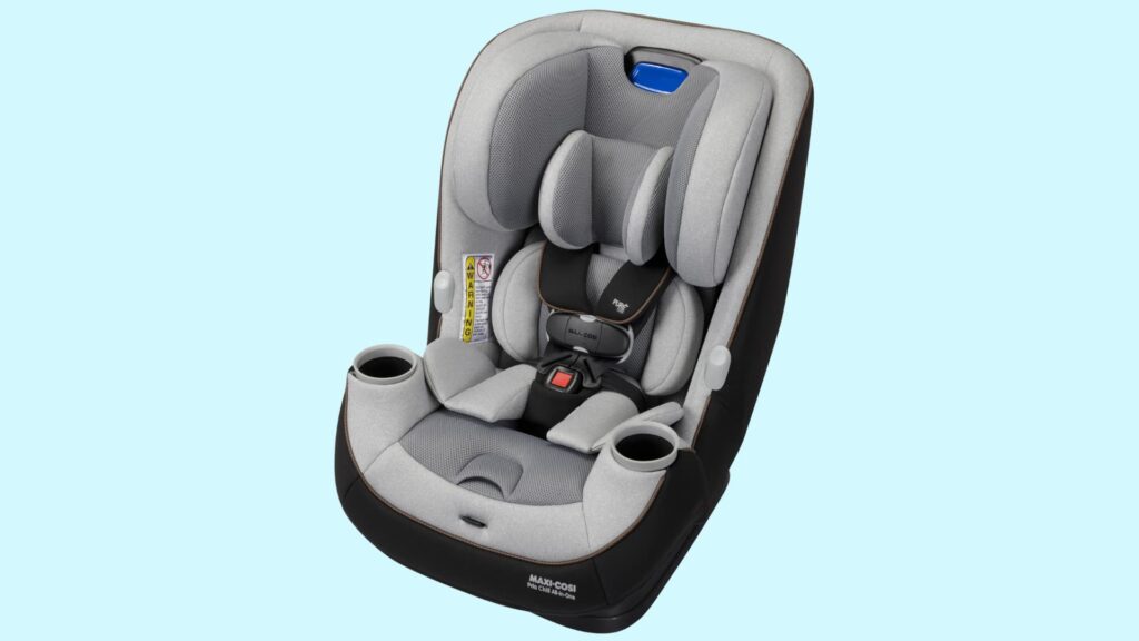 All-in-one convertible car seat in gray and black with padded headrest, harness system, and dual cup holders on a light blue background
