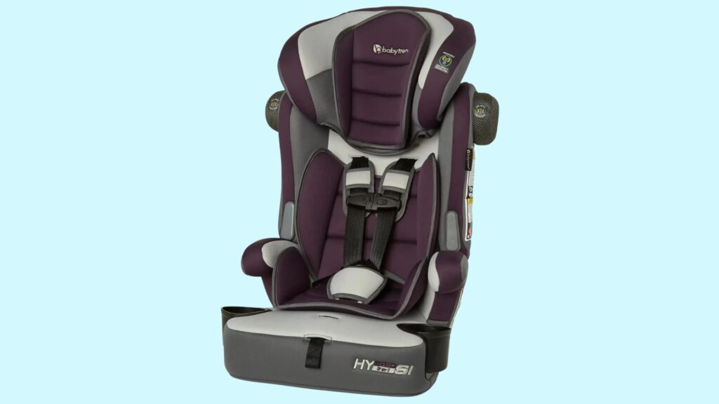 Combination car seat in purple and gray with a built-in harness, headrest, side impact protection, and cup holders on a light blue background
