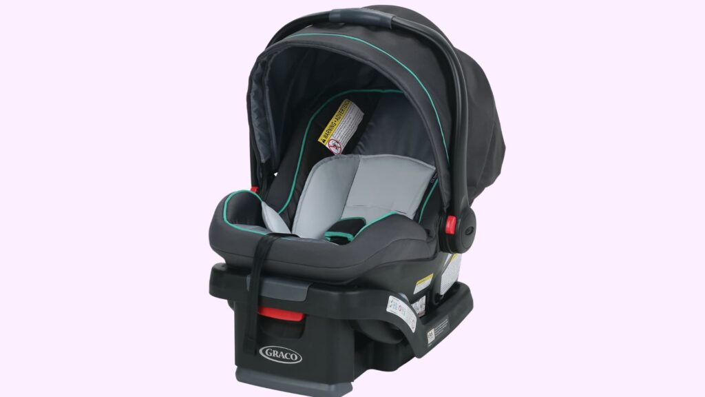 Graco SnugRide SnugLock 35 infant car seat in black and gray with canopy and carry handle, mounted on a black base, shown against a plain background
