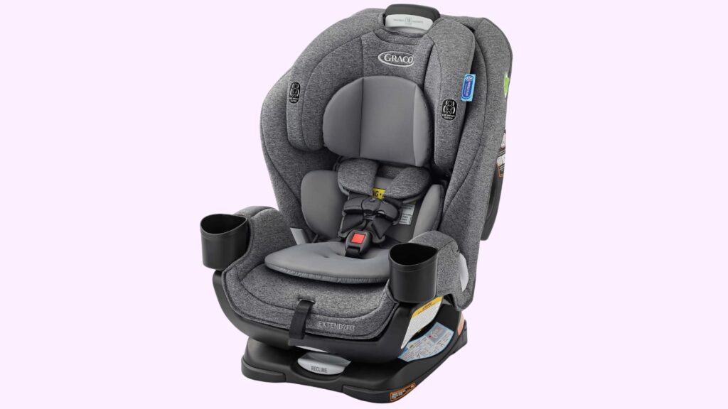 Graco SnugRide SnugLock 35 infant car seat in black and gray with canopy and carry handle, mounted on a black base, shown against a plain background.